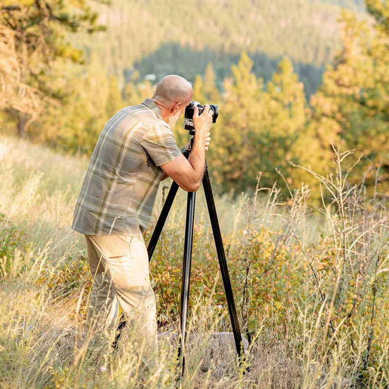 Load image into Gallery viewer, man using the revolve ultra compact tripod
